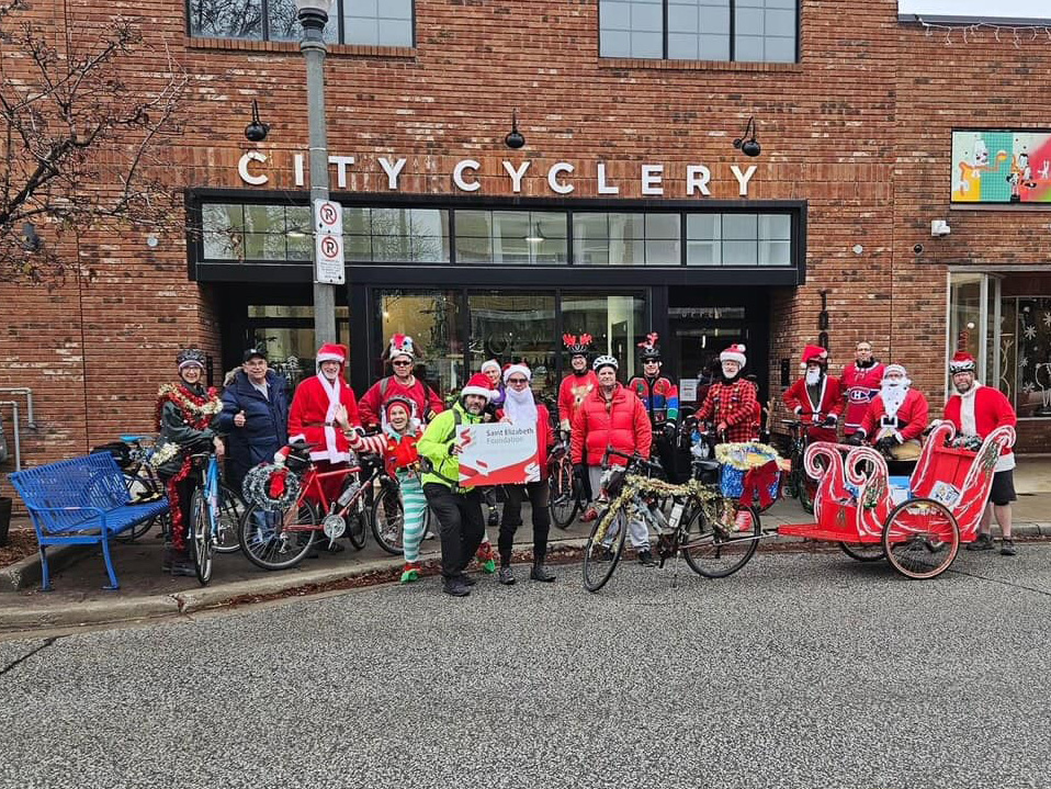Members of the Erie St. Clair SDC participate in the Santa Ride in a group photo